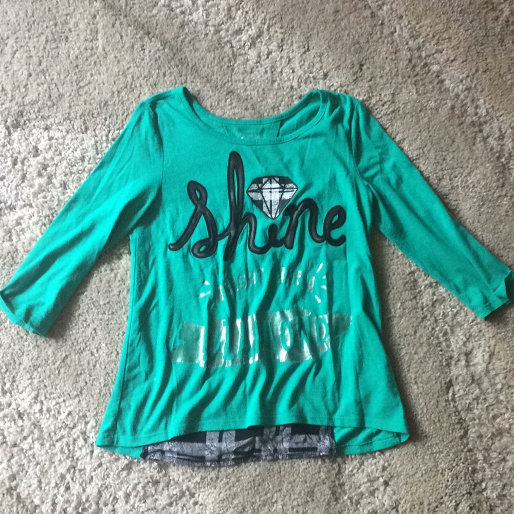 A green shirt it is light fabric